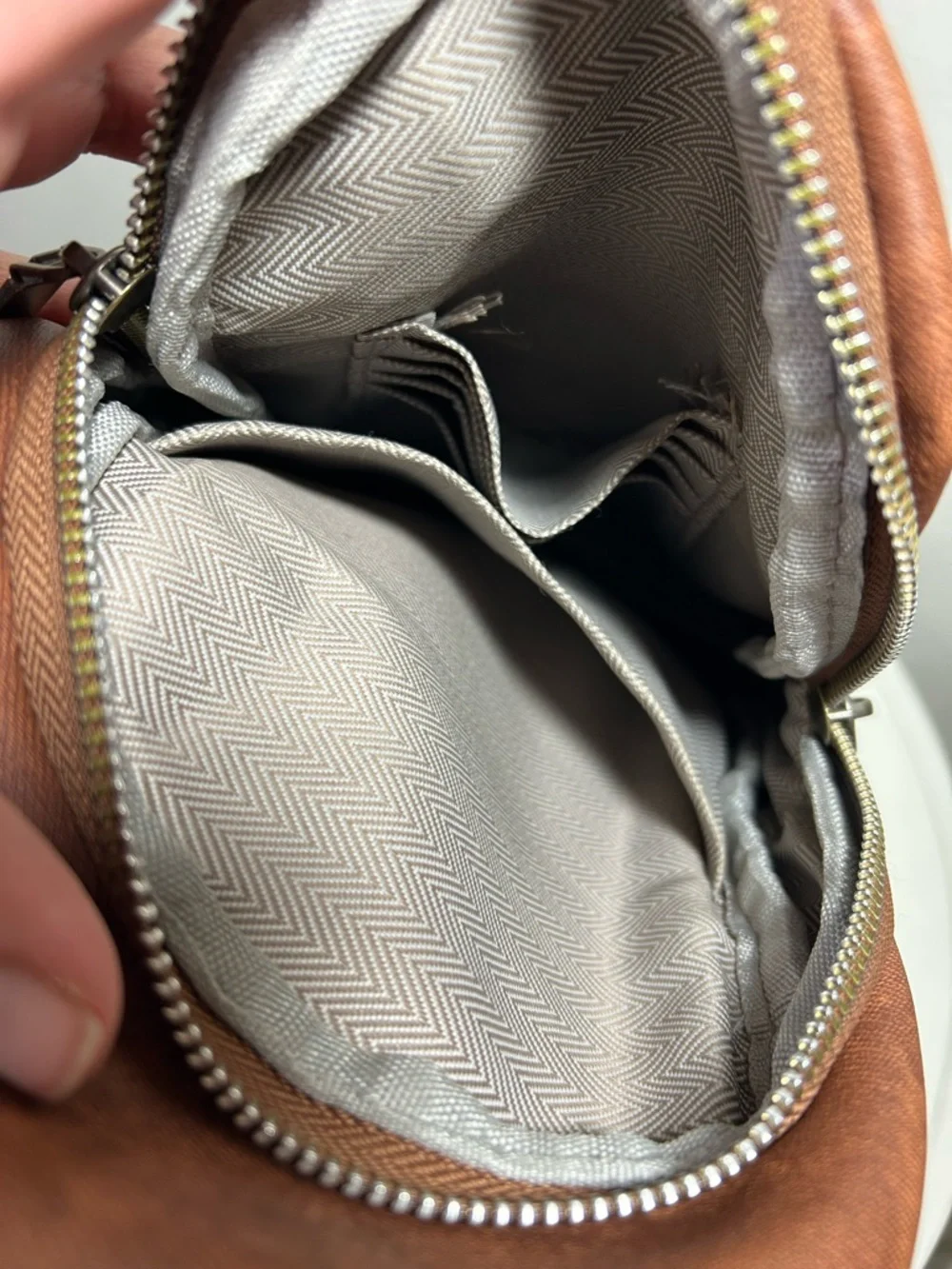 Brown Faux Leather Sling Backpack with Patterned Strap